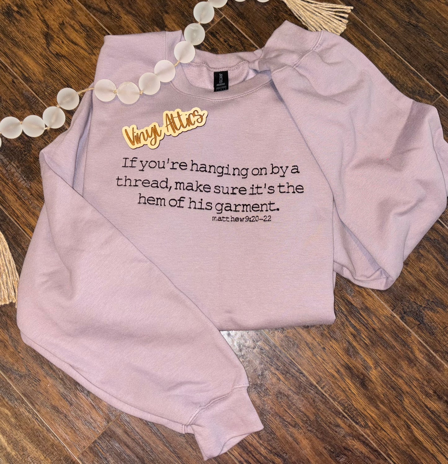 Hanging on by a thread embroidered sweatshirt